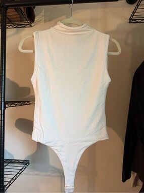 Dress Forum White Sleeveless Mock Neck Bodysuit
